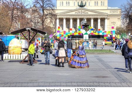 MOSCOW RUSSIA - April 24.2016: Artists in ball gowns offer tourists to take a photo