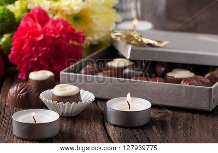 Chocolate Candy, Candles And Flowers