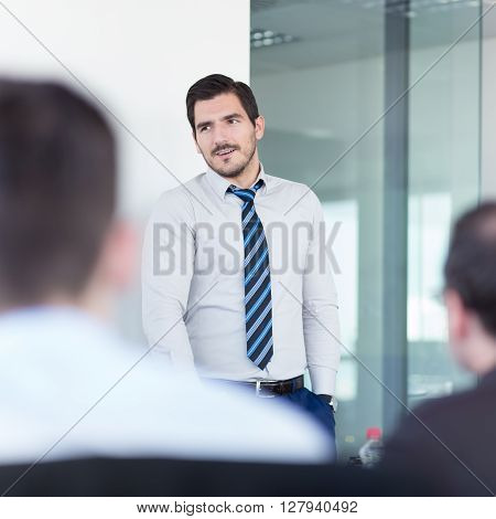 Relaxed team leader and business owner leading informal in-house business meeting. Business and entrepreneurship concept.