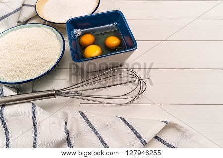 Ingredients for baking a cookies. Recipe for coconut macaroons. Top view with copy space.