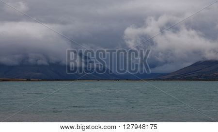 Rainy day in New Zealand. Summer scene at Lake Ohau South Island.