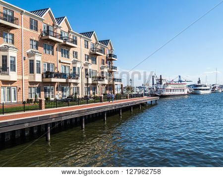 BALTIMORE-APRIL 23 - Luxury waterfront townhouses along the Baltimore Waterfront Promenade on April 23 2016 in Baltimore Maryland.