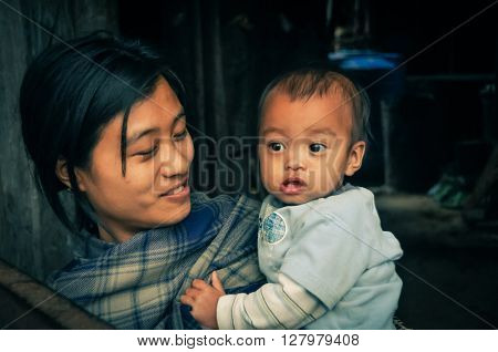 Smiling Mother And Child