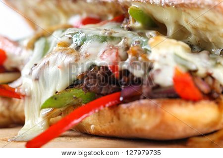 Tasty Beef Steak Sandwich With Onions, Mushroom And Melted Provolone Cheese In A Ciabatta