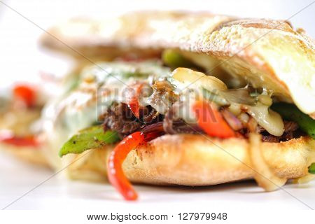 Tasty Beef Steak Sandwich With Onions, Mushroom And Melted Provolone Cheese In A Ciabatta