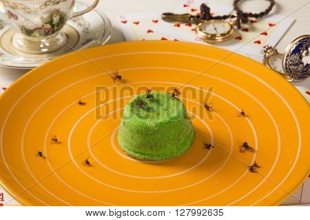 Petit gateau with green sava ant. Gourmet dessert.
