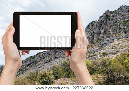 Travel Concept - Tourist Photographs Old Rocks At Demerdzhi (demirci) Mountain From The Valley Of Gh