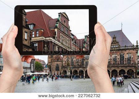 Travel Concept - Tourist Photographs Old House On Bremer Marktplatz (bremen Market Square) In Bremen