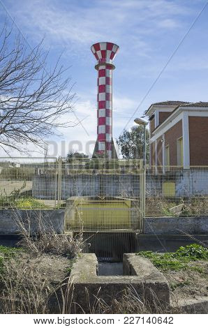 Irrigation Water Tank Over Blue Sky. Concrete Tower Made For Store Irrigation Water, Vegas Bajas Del