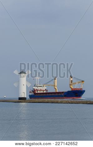 Seascape - Navigation Mark And Freighter Sailing On The Sea