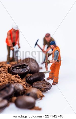 Miniature Figures Working On Coffee Macro Photography On White Background