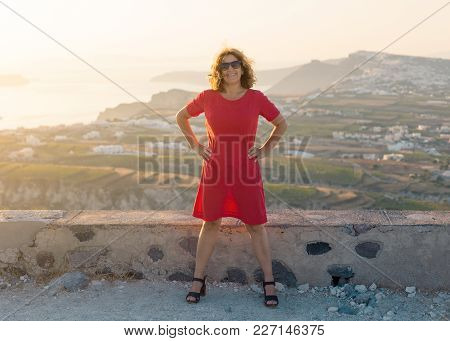 Happy Woman Smiling With Wind In The Hair Next To The Viepoint At Beautiful Sunset. Lifestyle And Tr