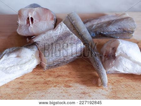 Fresh Raw Fish On A Kitchen Board