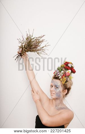 A Young Womaa Young Woman With Flowers On Her Head And Hands. Spring Image With Flowers. Man With A 