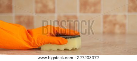 Housewife Cleaning An Induction Surface, Closeup Shot.