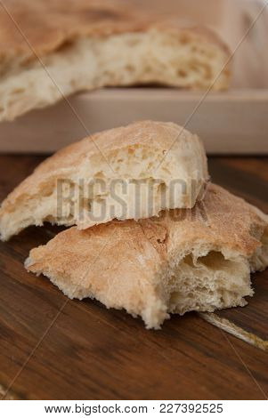 Fresh Sliced Pita Bread On The Wood Table. Georgean Traditional Bread. Bakerry Food Concept.