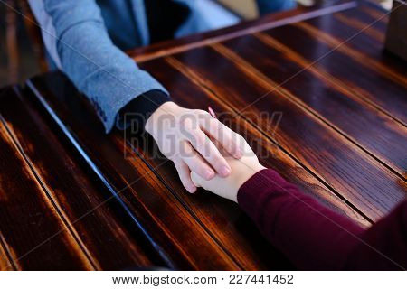 Bride And Groom Holding Hands Discuss Wedding And Honeymoon In Paris In Coffee House, Lovers On Date