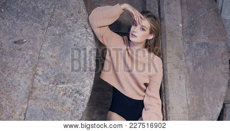 Stylish Woman In A Black Panties And Cream Pullover.