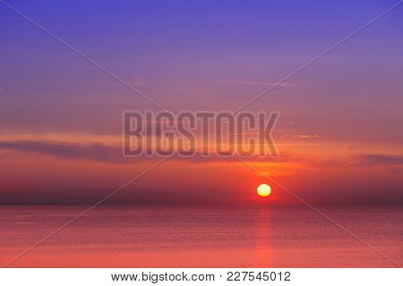 Eautiful Red-purple Sunset At Sea. Evening Calm