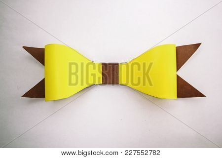 Horizontal Silk Lemon Yellow Bows With Thin Ribbons Isolated On White Background