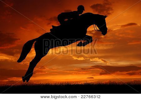 silhouette of a rider on a  jumping  horse