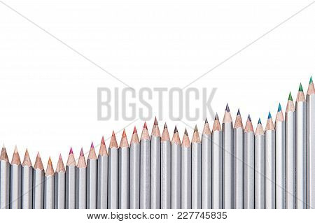 Colored Pencils Laid Out On White Isolated Background