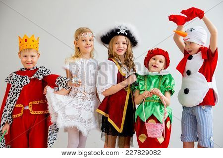 Several Kids In Different Costumes Having Party