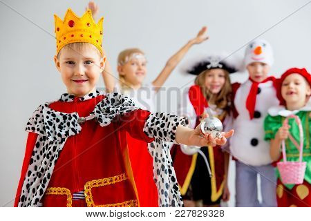Several Kids In Different Costumes Having Party