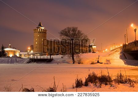 Beautiful View Landmark: Marinkin Tower Of Kremlin With Illumination From Lamp On Blue Sky With Clou