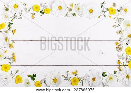 A Bouquet Of White Flowers Cosmea Or Cosmos With Ribbon On White Boards. Garden Yellow Flowers Over 
