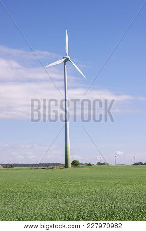 Wind Turbine Surrounded By Nature