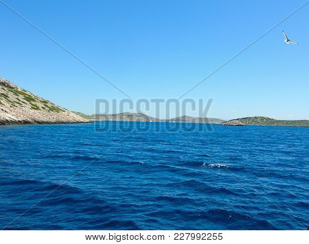 Sea Surface Aerial View. Background Shot Of Clear Sea Water Surface. Blue Sea Water In Calm. Sea Tex