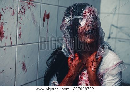 Horror Scence Of Woman Cover The Plastic Bag In Head In Toilet
 At Abandoned House.ghost Women Wear 