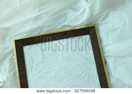 Wooden Picture Frame On White Plastic Bag Packing Stacking