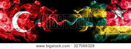 Turkey Vs Togo, Togolese Smoke Flags Placed Side By Side. Thick Colored Silky Smoke Flags Of Turkish
