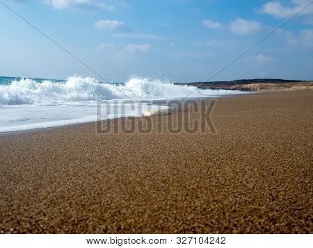 Foam And Waves In The Sea On A Sunny Day. Foam And Waves In The Sea. Powerful Waves Crushing For Bac