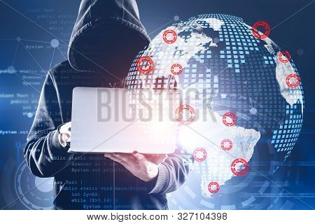 Young Hacker In Hoodie Using Laptop Over Blue Background With Double Exposure Of Hud Futuristic Inte