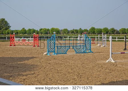 Image Of Show Jumping Poles On The Training Field. Wooden Barriers For Jumping Horses As A Backgroun