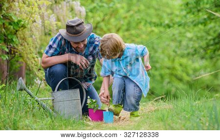 Little Helper In Garden. Planting Flowers. Make Planet Greener. Growing Plants. Take Care Of Plants.