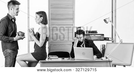 Rest Break At Work. Business Partners Enjoying Conversation In Lunch Break While Colleague Working I