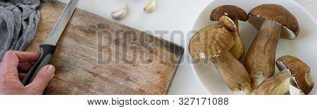 Personal Perspective Of Woman Hands Preparing Porcini Mushrooms (boletus Edible) For Cooking Them