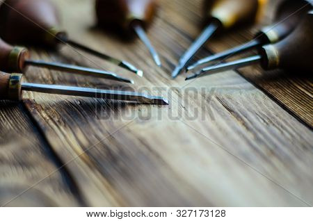 Different Gravers For Jewelry On A Wooden Background