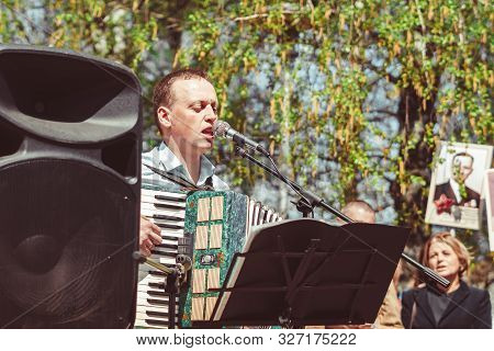 Russia, Siberia, Novokuznetsk - May 9, 2019: Musicians Sing Songs On The Street On Victory Day