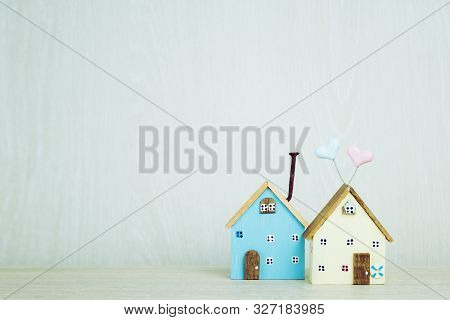 Two Miniature Home, Minimal Driftwood Model Wood House On Table. Idea For Offers Of Mortgage Investm
