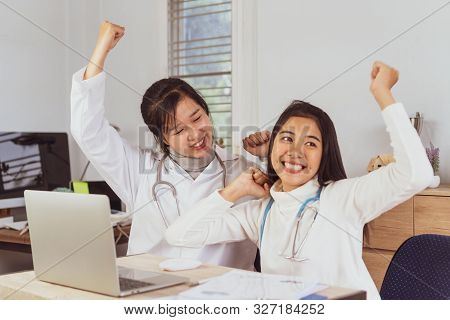 Happy Medical Student,online Doctoring,asian Teenage Doctor Intern Working Healthcare Medical Teamwo