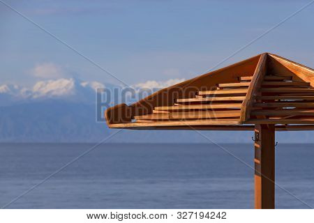 Part Of A Parasol Close-up On The Background Of Lake Issyk-kul. Kyrgyzstan