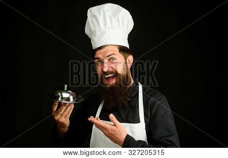 Serving And Presentation. Chef Cook Holds Metallic Dish. Cook Holds Cloche In Restaurant. Cooking. R