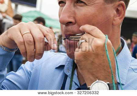 Ufa, Russia. July 12, 2019. Bashkir Turk Person Playing An Ethnic Lamellophone Instrument Known As J