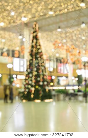 Abstract Christmas Background With Christmas Tree With Decorations, Defocused Bokeh Lights.