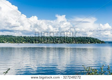 Billowing Clouds Hover Over Mercer Island In Washington State.